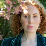 Amazonite, blue labradorite, crystal, pyrite, and cubic zirconia gemstones held within a mini bronze marquise earring with hammered brass twist wire accent