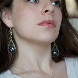 Mint fresh water pearl coin held within a brass pendant necklace filled with amazonite and crystal gemstones along side with oxidized sterling silver twist wire