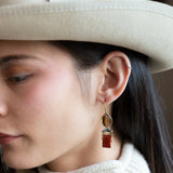 Brick red jasper rectangle wrapped in gold filled wire and cat's eye gemstones hanging from a smokey quartz wrapped in gold filled wire earrings