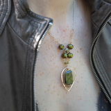 Handmade sterling silver necklace with flashy green labradorite accented with olive green fresh water pearl, rough pyrite, and cubic zirconia gemstones. Gold-filled wire and diamond cut links, with sterling silver box chain