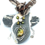 Handmade sterling silver necklace with flashy green labradorite accented with olive green fresh water pearl, rough pyrite, and cubic zirconia gemstones. Gold-filled wire and diamond cut links, with sterling silver box chain