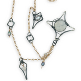 Gold filled and oxidized sterling silver star charm necklace with rainbow moonstone, and silver blue fresh water pearl accents