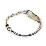 Half oxidized sterling, half braided brass bracelet with a large opal teardrop accented with moonstone gemstones