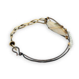 Half oxidized sterling, half braided brass bracelet with a large opal teardrop accented with moonstone gemstones