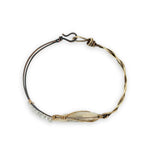 Half oxidized sterling, half braided brass bracelet with a large opal teardrop accented with moonstone gemstones