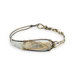 Half oxidized sterling, half braided brass bracelet with a large opal teardrop accented with moonstone gemstones
