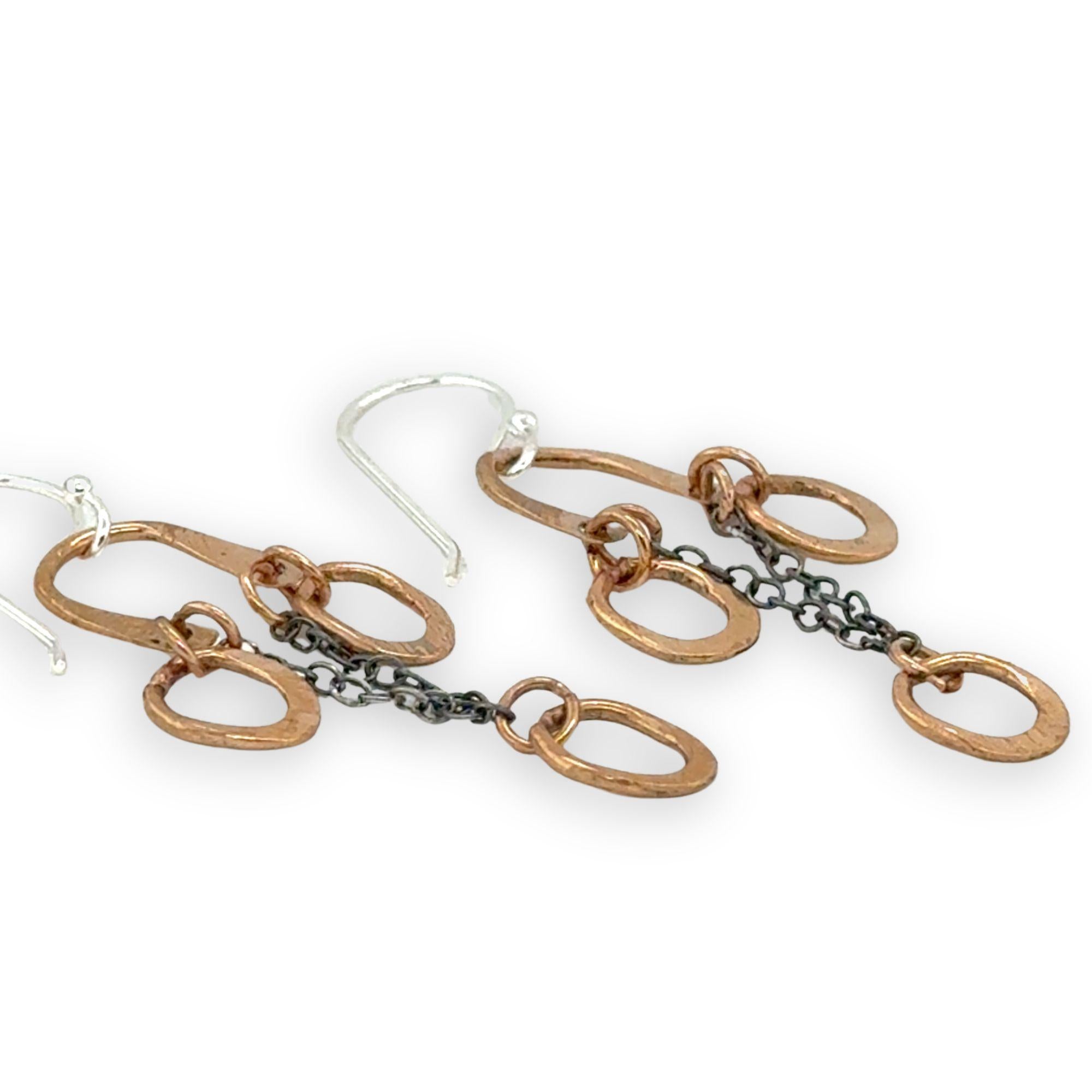 Bronze arch tops and hammered oval charm earrings featuring delicate darkened sterling silver chain