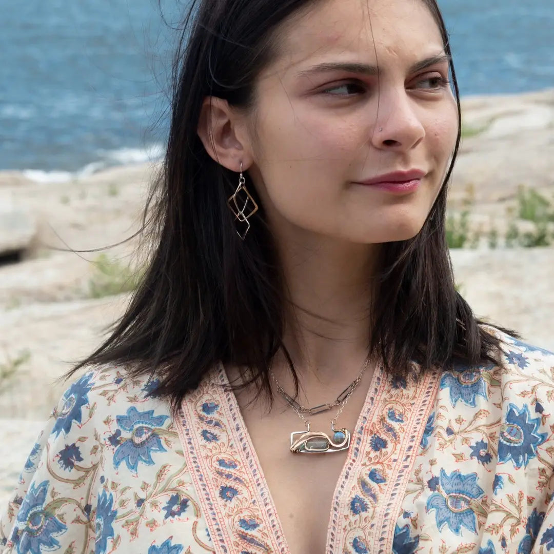 interlocking bronze and sterling silver handmade hammered diamonds to form a mobile shaped earrings