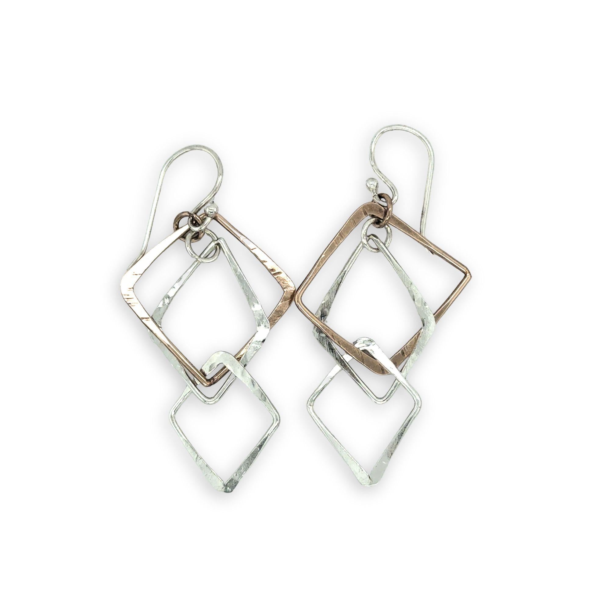 interlocking bronze and sterling silver handmade hammered diamonds to form a mobile shaped earrings