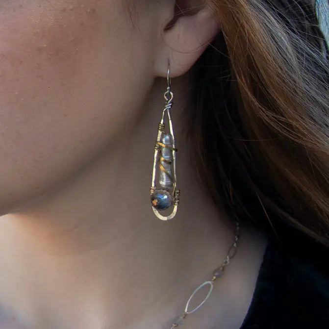 Sterling silver skinny drop earrings with fresh water stick pearls wrapped in brass wire and a crystal disco ball nested in gold filled wire