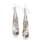 Sterling silver skinny drop earrings with fresh water stick pearls wrapped in brass wire and a crystal disco ball nested in gold filled wire