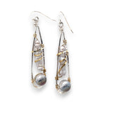 Sterling silver skinny drop earrings with fresh water stick pearls wrapped in brass wire and a crystal disco ball nested in gold filled wire