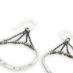 Star and dandelion stamped and hammered sterling silver organic hoops hanging from layers of darkened sterling silver delicate chain earrings