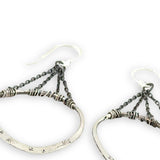 Star and dandelion stamped and hammered sterling silver organic hoops hanging from layers of darkened sterling silver delicate chain earrings