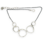 handmade hammered floral stamped sterling silver organic shapes varied in size hanging from oxidized sterling silver dainty chain necklace