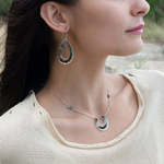 A pair of sterling silver channel drop earrings with blue opal nuggets and blue tourmaline micro faceted gemstones, featuring tiny crystal accents.