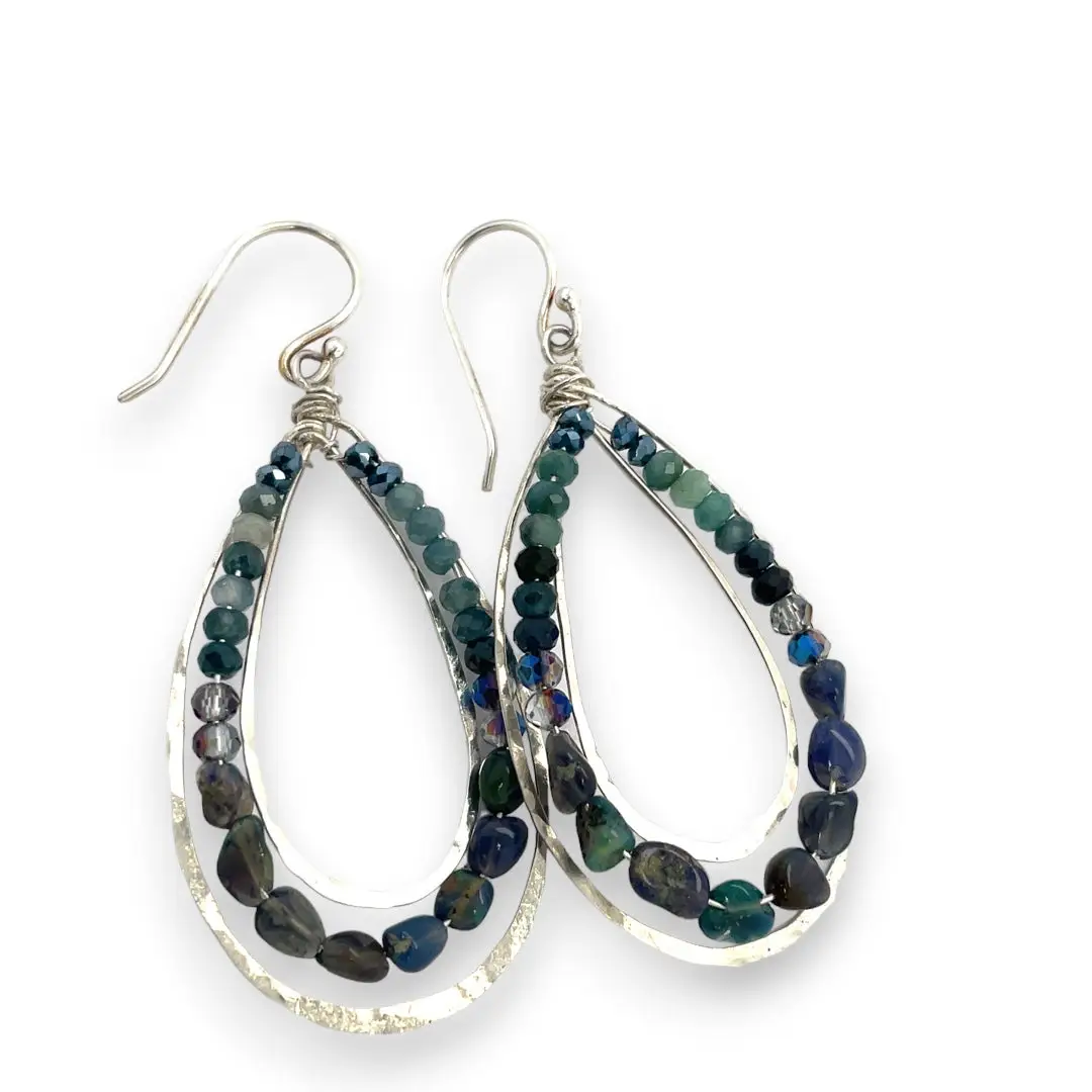 A pair of sterling silver channel drop earrings with blue opal nuggets and blue tourmaline micro faceted gemstones, featuring tiny crystal accents.