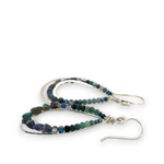 A pair of sterling silver channel drop earrings with blue opal nuggets and blue tourmaline micro faceted gemstones, featuring tiny crystal accents.