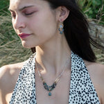 pair of handmade bronze drop earrings with quartz coins, crystal, blue opal, and moss agate faceted gemstones held on gold filled wire