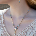 Brass overlapping hammered drops with a singular silver blue fresh water pearl dangle