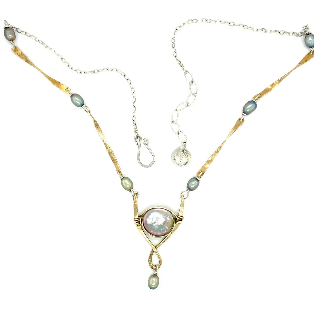 Handmade brass necklace with twisted bars intersperse with silver blue fresh water pearls and a sterling silver chain