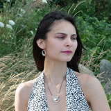 Oxidized sterling silver mini hoops lined with moonstone and fresh water pearls in gold filled wire on sterling silver earring hooks