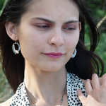 Oxidized sterling silver mini hoops lined with moonstone and fresh water pearls in gold filled wire on sterling silver earring hooks