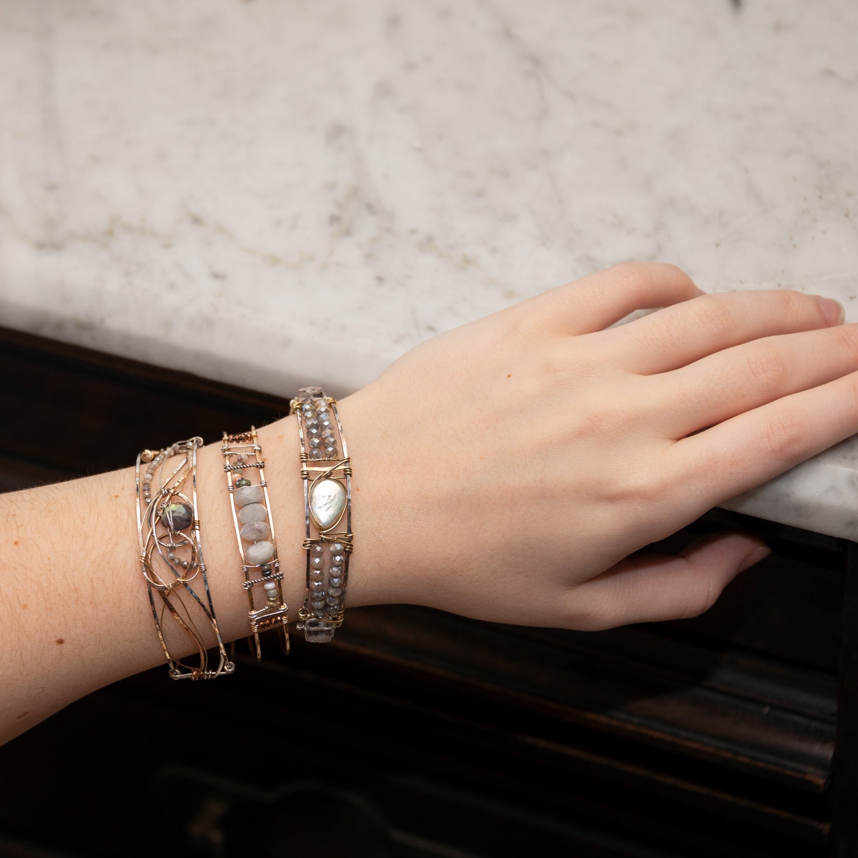 Bronze skinny bracelet with flashy moonstone, opal, and pyrite gemstones