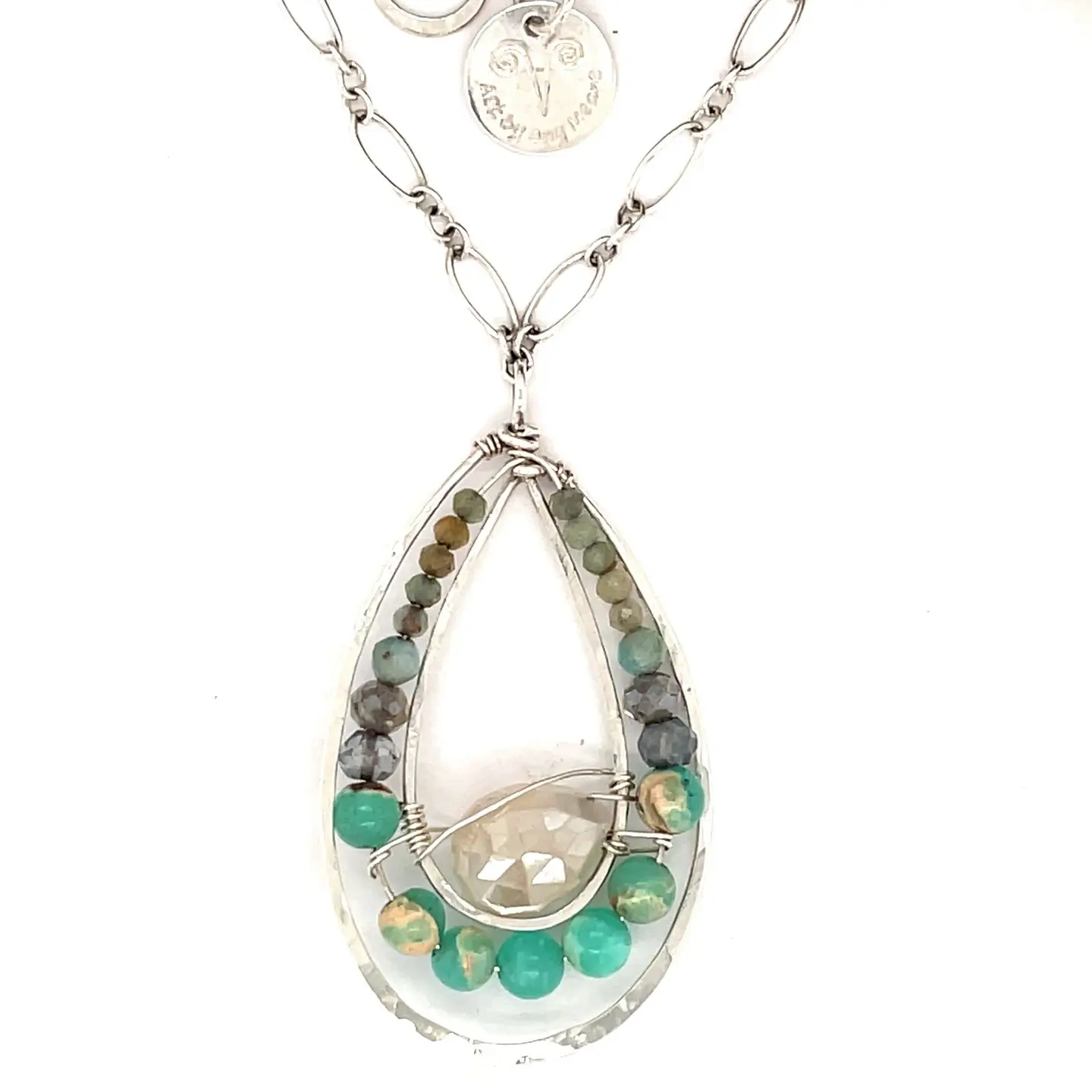 Moonstone drop gemstone held inside a sterling silver channel drop necklace lined with moss agate, amazonite, and terra verde jasper gemstones on a delicate sterling silver chain