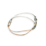 Half sterling silver, half bronze hammered arrow shaped bracelet embellished with an iolite sphere and fancy jasper gemstones