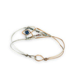 Half sterling silver, half bronze hammered arrow shaped bracelet embellished with an iolite sphere and fancy jasper gemstones