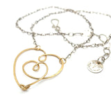 handmade hammered gold filled heart with one mini heart built in pendant on a sterling silver delicate heart chain