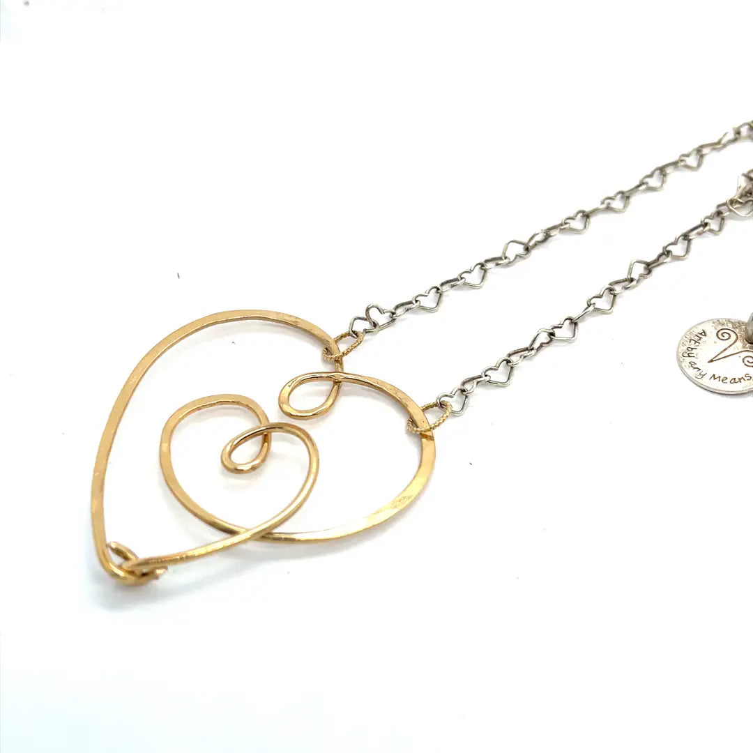 handmade hammered gold filled heart with one mini heart built in pendant on a sterling silver delicate heart chain