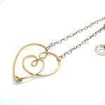 handmade hammered gold filled heart with one mini heart built in pendant on a sterling silver delicate heart chain