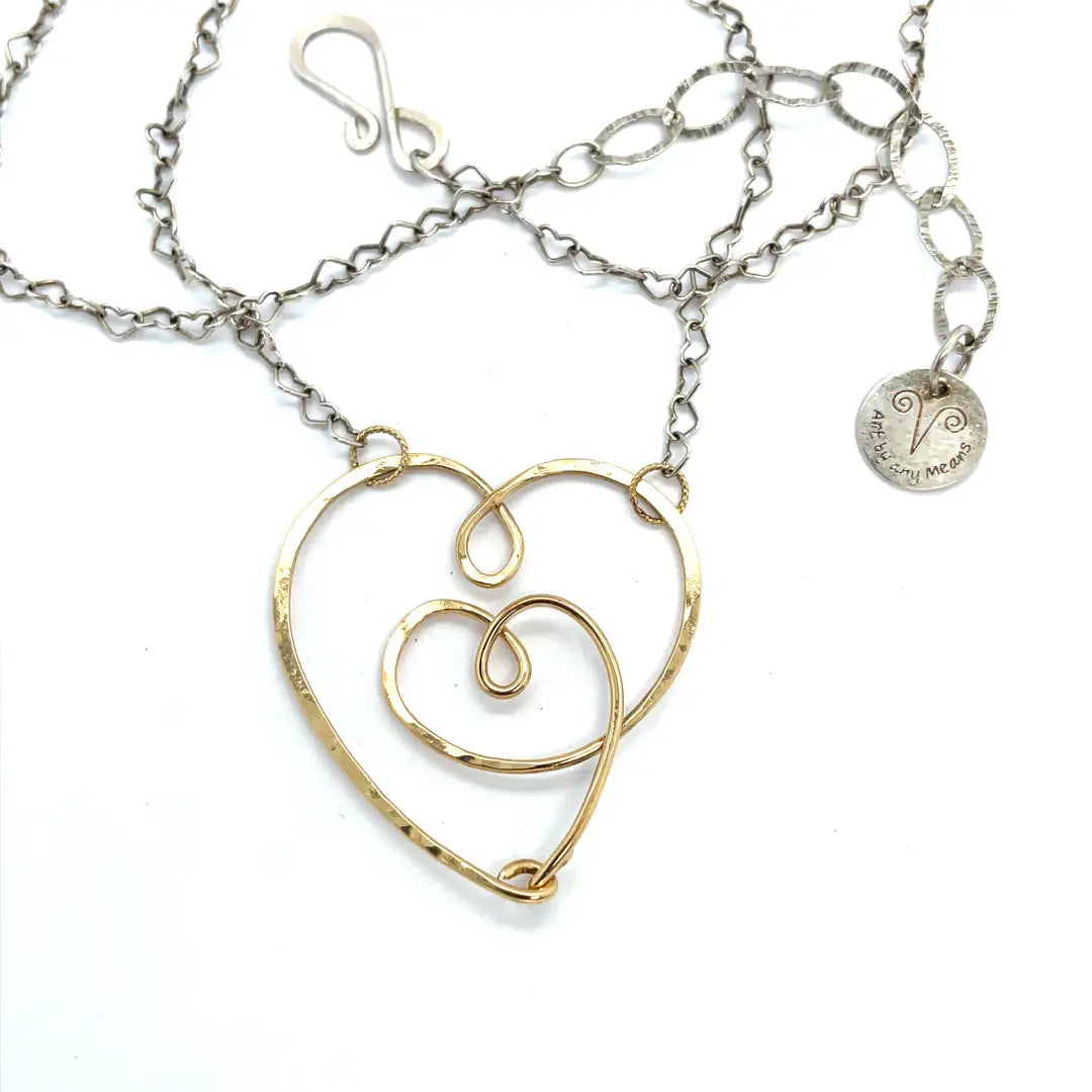 handmade hammered gold filled heart with one mini heart built in pendant on a sterling silver delicate heart chain
