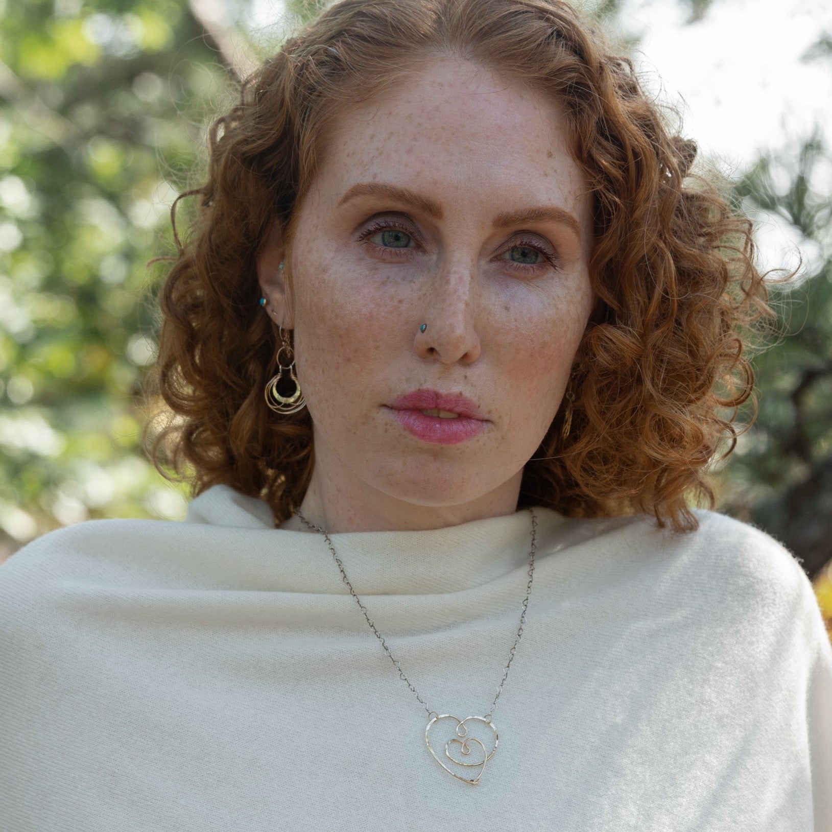 handmade hammered gold filled heart with one mini heart built in pendant on a sterling silver delicate heart chain