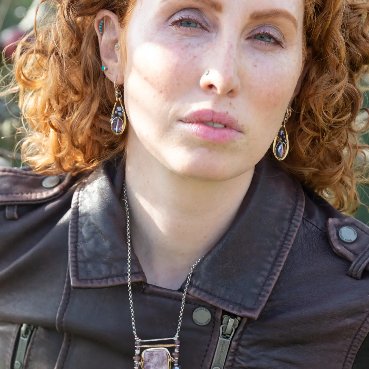 Pair of brass mini earrings with magenta crystal and fresh water pearl wrapped in sterling silver wire
