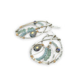 Aquamarine, amazonite, and crystal gemstones line the inside of our sterling silver nautilus shell earrings with gold filled wire