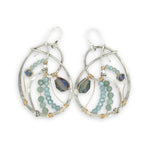 Aquamarine, amazonite, and crystal gemstones line the inside of our sterling silver nautilus shell earrings with gold filled wire