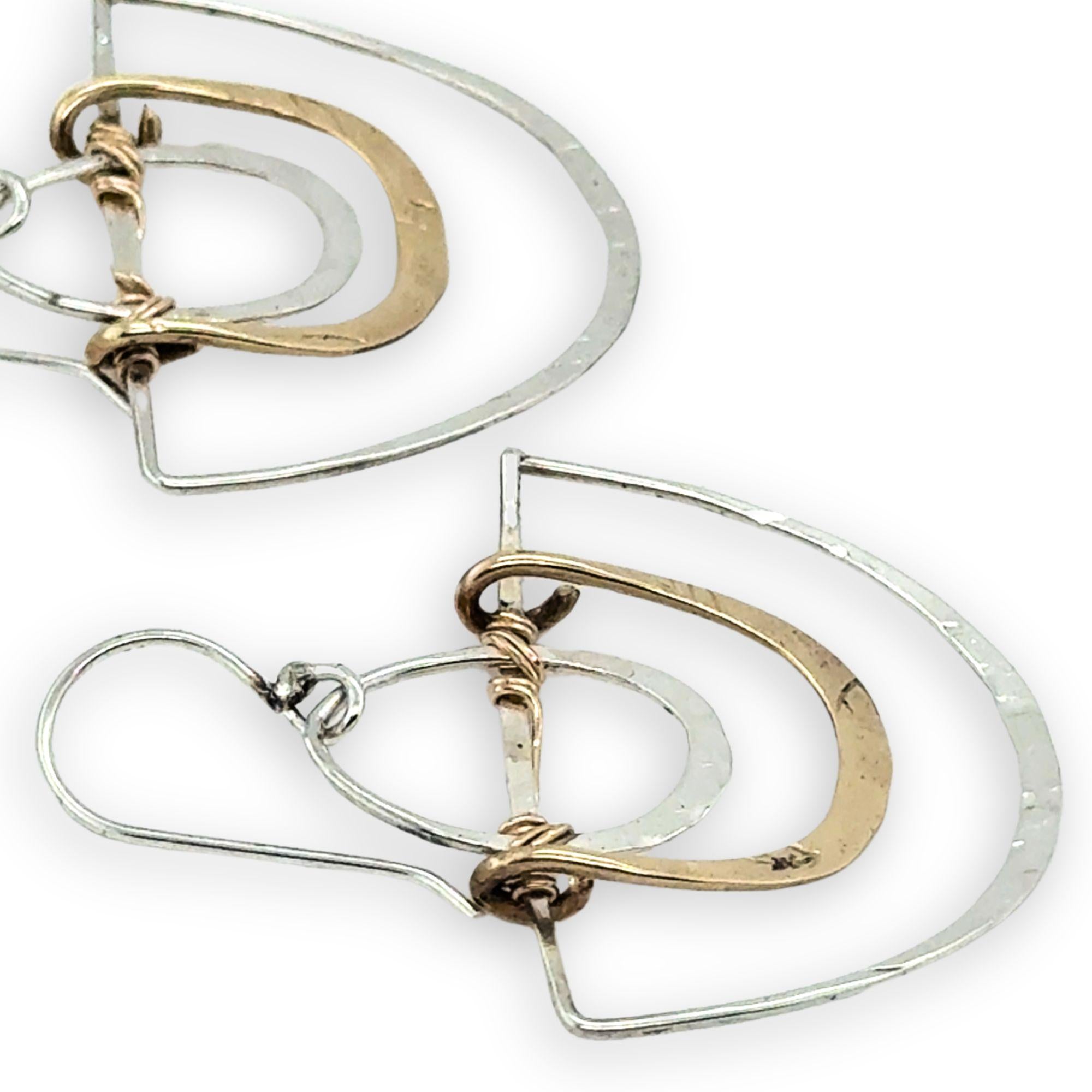 Handmade sterling silver half moons with sterling silver mini ovals and stamped brass arches attached to them with gold filled wire