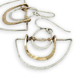 Handmade sterling silver half moons with sterling silver mini ovals and stamped brass arches attached to them with gold filled wire