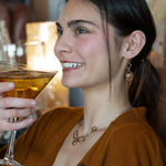 Handmade bronze mini earrings with a neutral pink fresh water pearl drop and hessonite garnet accents