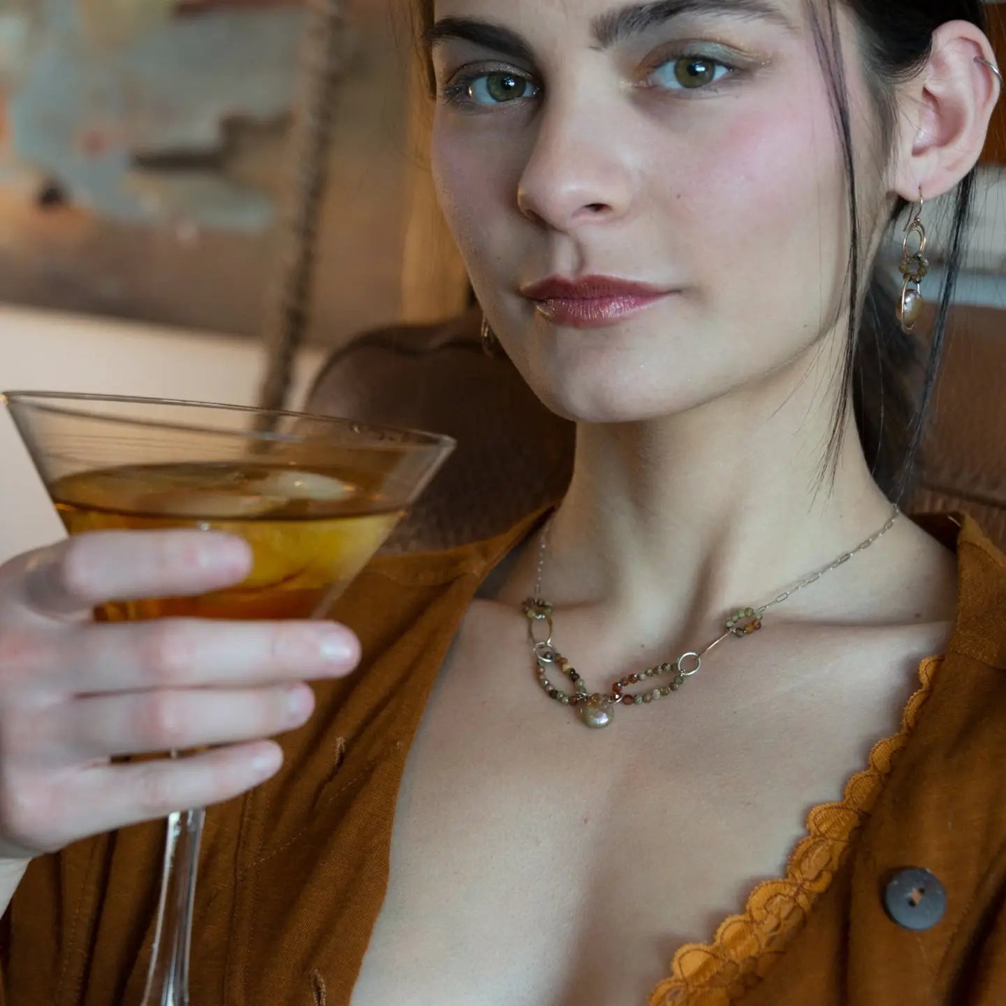 Handmade bronze mini earrings with a neutral pink fresh water pearl drop and hessonite garnet accents