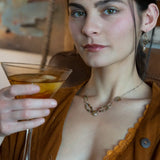 Handmade bronze mini earrings with a neutral pink fresh water pearl drop and hessonite garnet accents