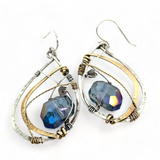 Blue crystal with labradorite accent on  stamped and darkened sterling silver drop earring with a brass hammered swish
