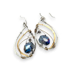 Blue crystal with labradorite accent on  stamped and darkened sterling silver drop earring with a brass hammered swish