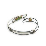 Bright and darkened sterling silver hammered point cuff bracelet with olive green fresh water pearls