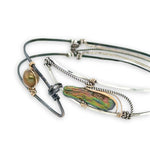 Bright and darkened sterling silver hammered point cuff bracelet with olive green fresh water pearls