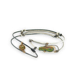 Bright and darkened sterling silver hammered point cuff bracelet with olive green fresh water pearls