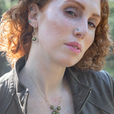 Sterling silver and brass handmade mini earrings featuring an olive green round fresh water pearl